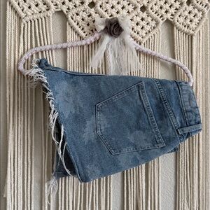 High-rise button-fly shorts. Cut off style